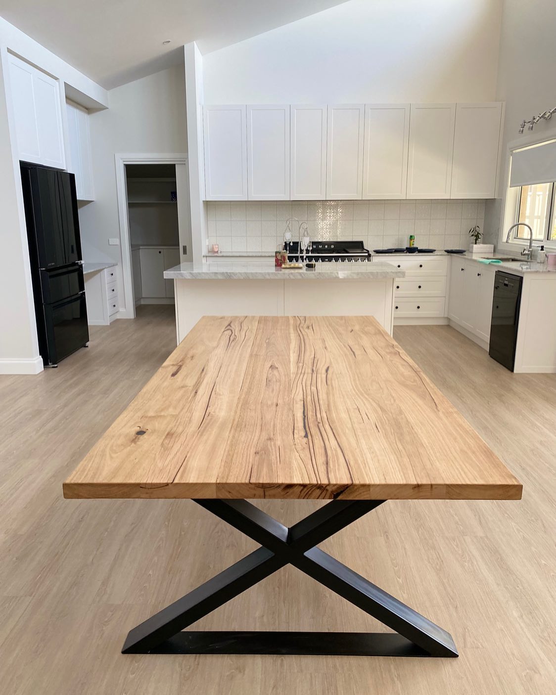 sorrento-reclaimed-messmate-dining-table-03 Reclaimed Wood Dining Table with black stell x leg design
